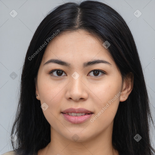 Joyful asian young-adult female with long  black hair and brown eyes