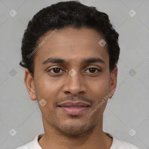 Joyful latino young-adult male with short  brown hair and brown eyes