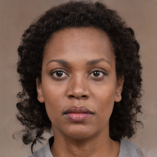 Neutral black young-adult female with medium  black hair and brown eyes