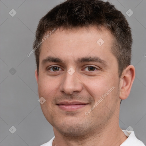 Joyful white young-adult male with short  brown hair and brown eyes