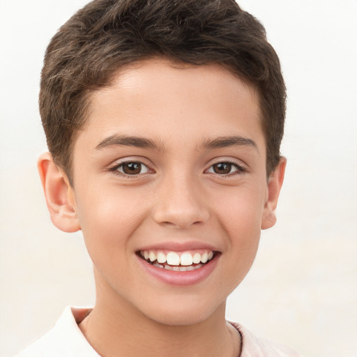 Joyful white child male with short  brown hair and brown eyes