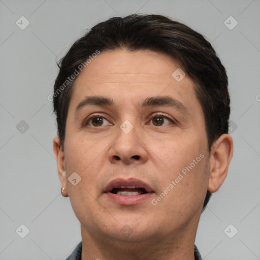 Joyful white adult male with short  brown hair and brown eyes