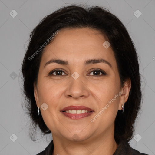 Joyful white adult female with medium  brown hair and brown eyes