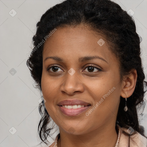 Joyful black young-adult female with long  brown hair and brown eyes