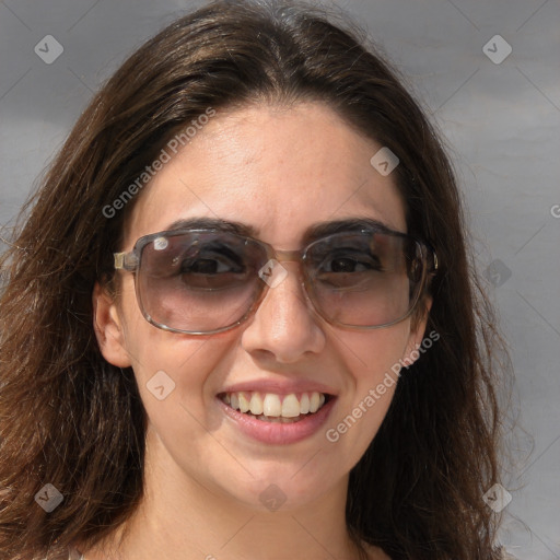 Joyful white adult female with long  brown hair and brown eyes