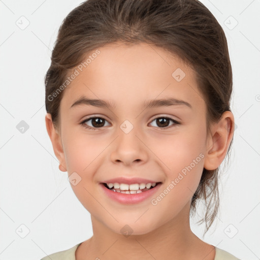 Joyful white child female with medium  brown hair and brown eyes