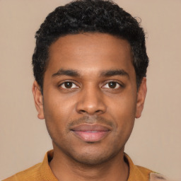 Joyful black young-adult male with short  black hair and brown eyes