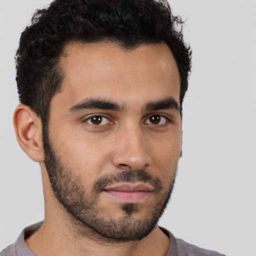 Neutral latino young-adult male with short  brown hair and brown eyes