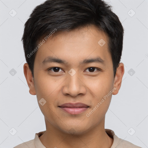 Joyful asian young-adult male with short  brown hair and brown eyes