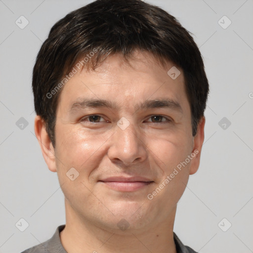 Joyful white adult male with short  brown hair and brown eyes