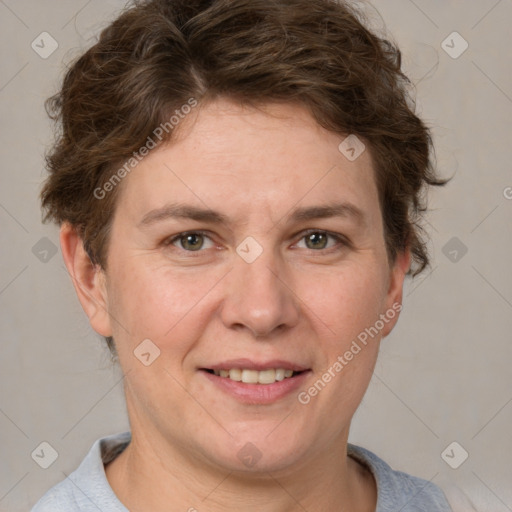 Joyful white adult female with short  brown hair and brown eyes