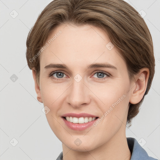 Joyful white young-adult female with short  brown hair and grey eyes