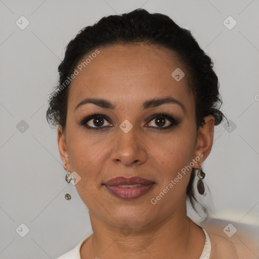 Joyful black adult female with short  black hair and brown eyes