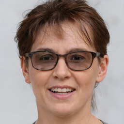 Joyful white adult female with short  brown hair and brown eyes