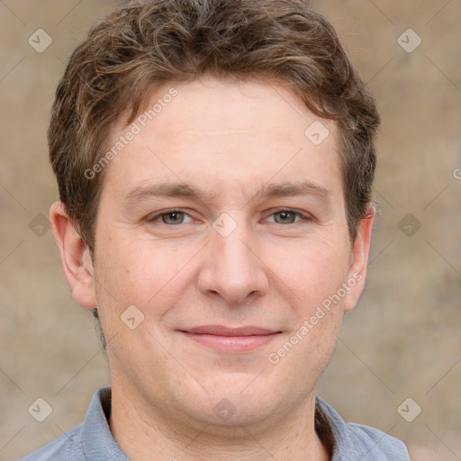 Joyful white adult male with short  brown hair and grey eyes