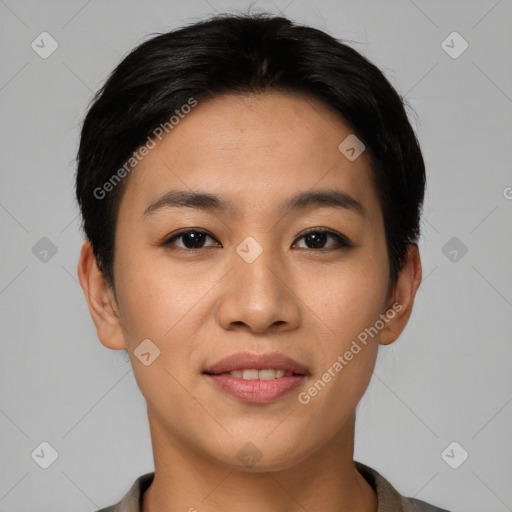 Joyful asian young-adult female with short  black hair and brown eyes