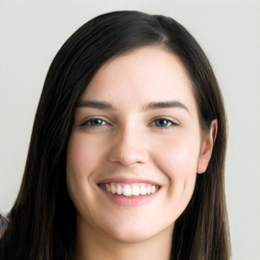 Joyful white young-adult female with long  black hair and brown eyes