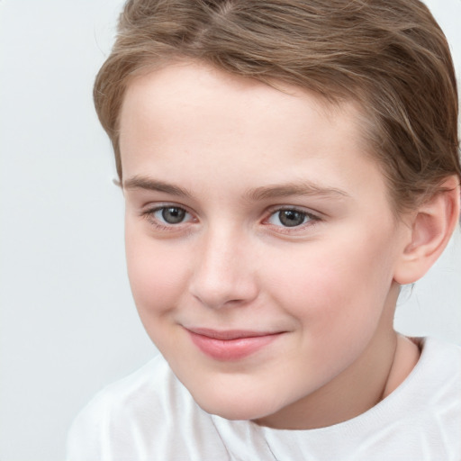 Joyful white child female with short  brown hair and brown eyes