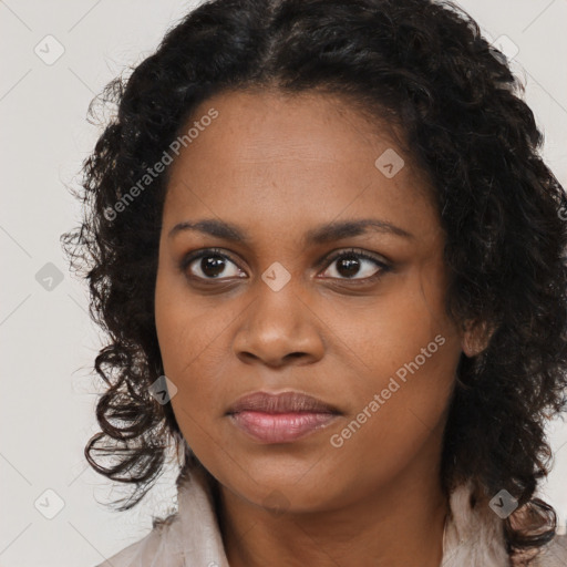 Joyful black young-adult female with long  brown hair and brown eyes