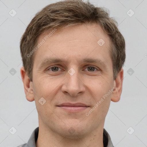 Joyful white adult male with short  brown hair and grey eyes