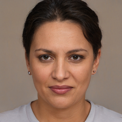 Joyful white adult female with short  brown hair and brown eyes