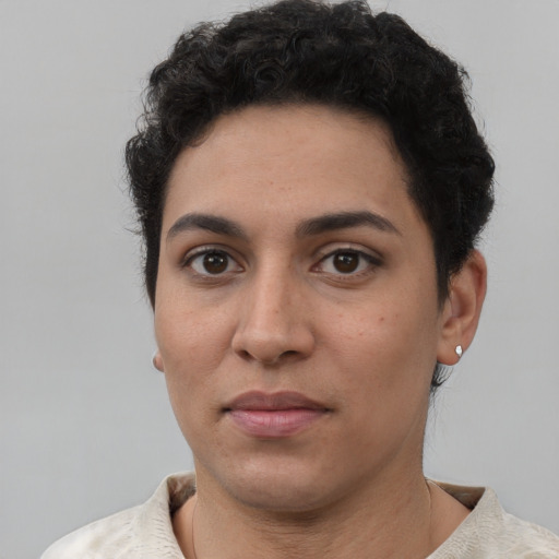 Joyful white young-adult female with short  black hair and brown eyes
