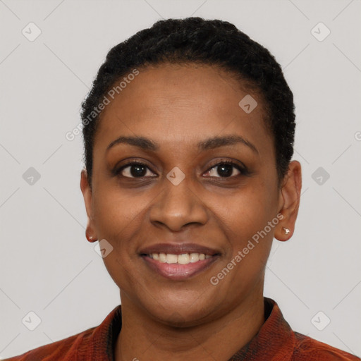 Joyful black young-adult female with short  black hair and brown eyes
