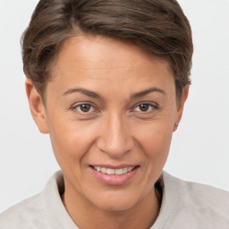 Joyful white adult female with short  brown hair and brown eyes