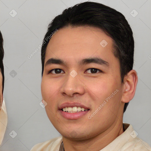 Joyful asian young-adult male with short  black hair and brown eyes