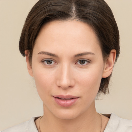 Neutral white young-adult female with medium  brown hair and brown eyes