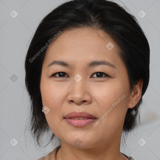 Joyful asian young-adult female with medium  brown hair and brown eyes