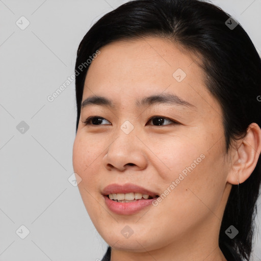 Joyful asian young-adult female with medium  brown hair and brown eyes