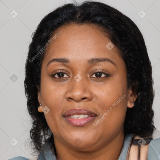 Joyful black adult female with medium  brown hair and brown eyes