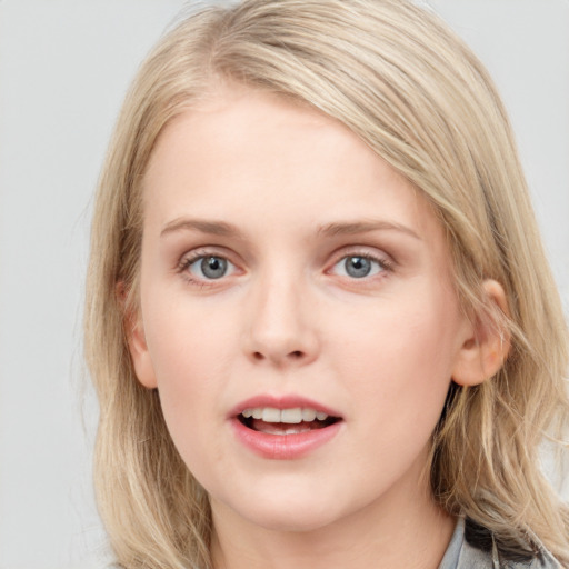 Joyful white young-adult female with medium  brown hair and blue eyes