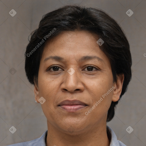 Joyful white adult female with short  brown hair and brown eyes