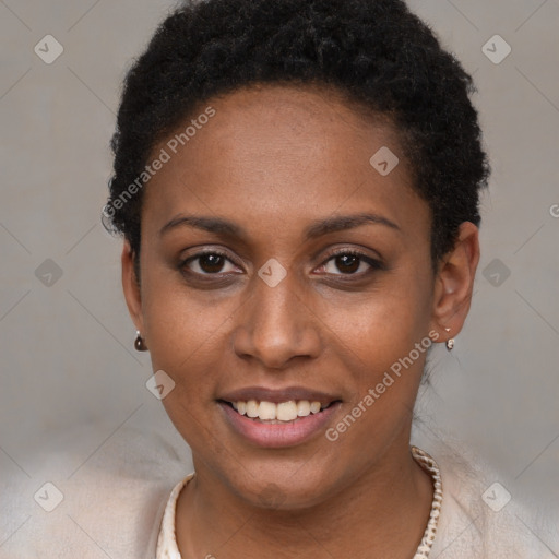 Joyful black young-adult female with short  brown hair and brown eyes