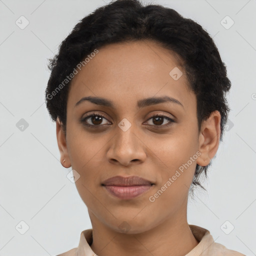 Joyful latino young-adult female with short  black hair and brown eyes