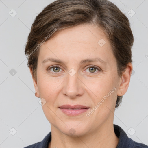 Joyful white adult female with short  brown hair and grey eyes