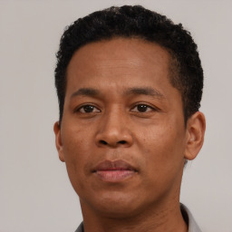 Neutral black young-adult male with short  brown hair and brown eyes