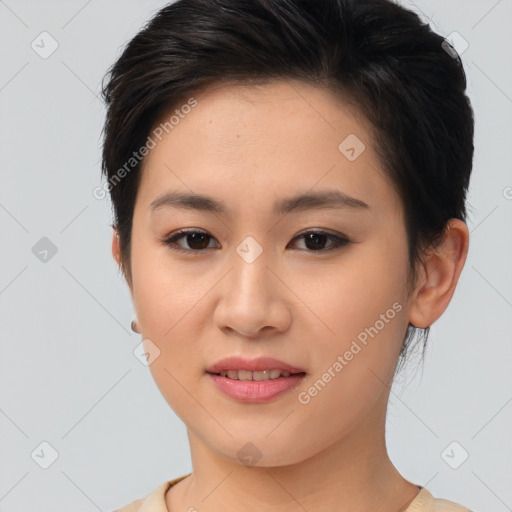 Joyful asian young-adult female with short  brown hair and brown eyes