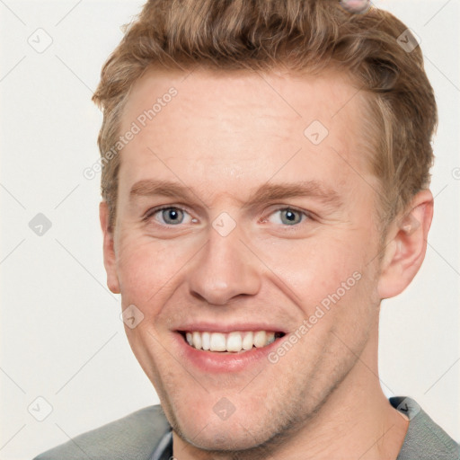 Joyful white adult male with short  brown hair and grey eyes