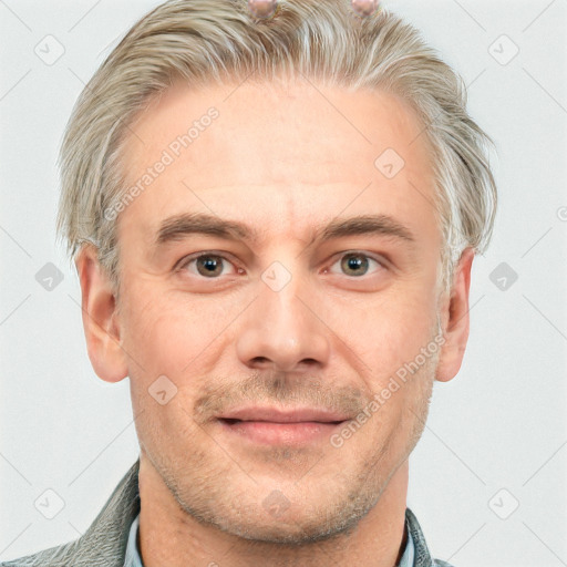 Joyful white adult male with short  brown hair and grey eyes