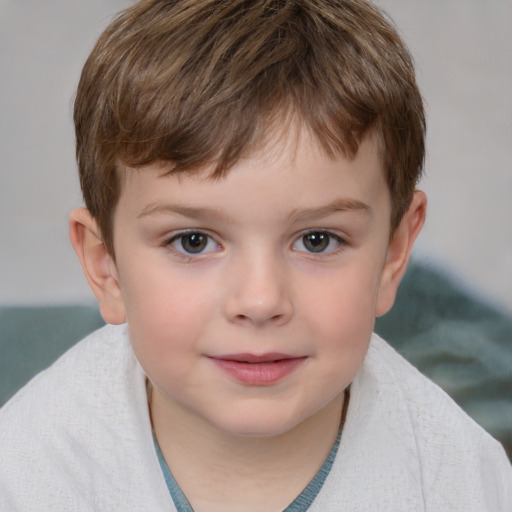 Joyful white child male with short  brown hair and grey eyes