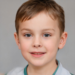 Joyful white child male with short  brown hair and brown eyes