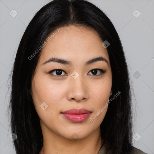 Joyful asian young-adult female with long  black hair and brown eyes