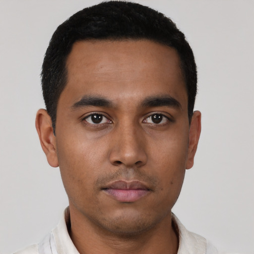 Neutral latino young-adult male with short  black hair and brown eyes