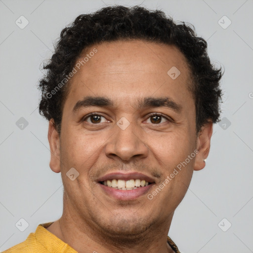 Joyful latino young-adult male with short  brown hair and brown eyes