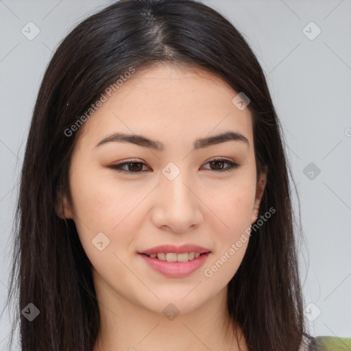 Joyful asian young-adult female with long  brown hair and brown eyes