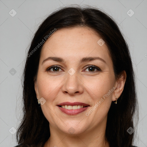 Joyful white adult female with long  brown hair and brown eyes