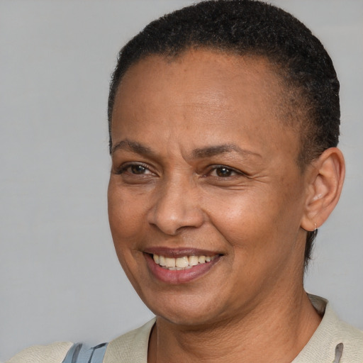 Joyful white adult female with short  brown hair and brown eyes